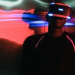Man wearing virtual reality goggles with neon lights