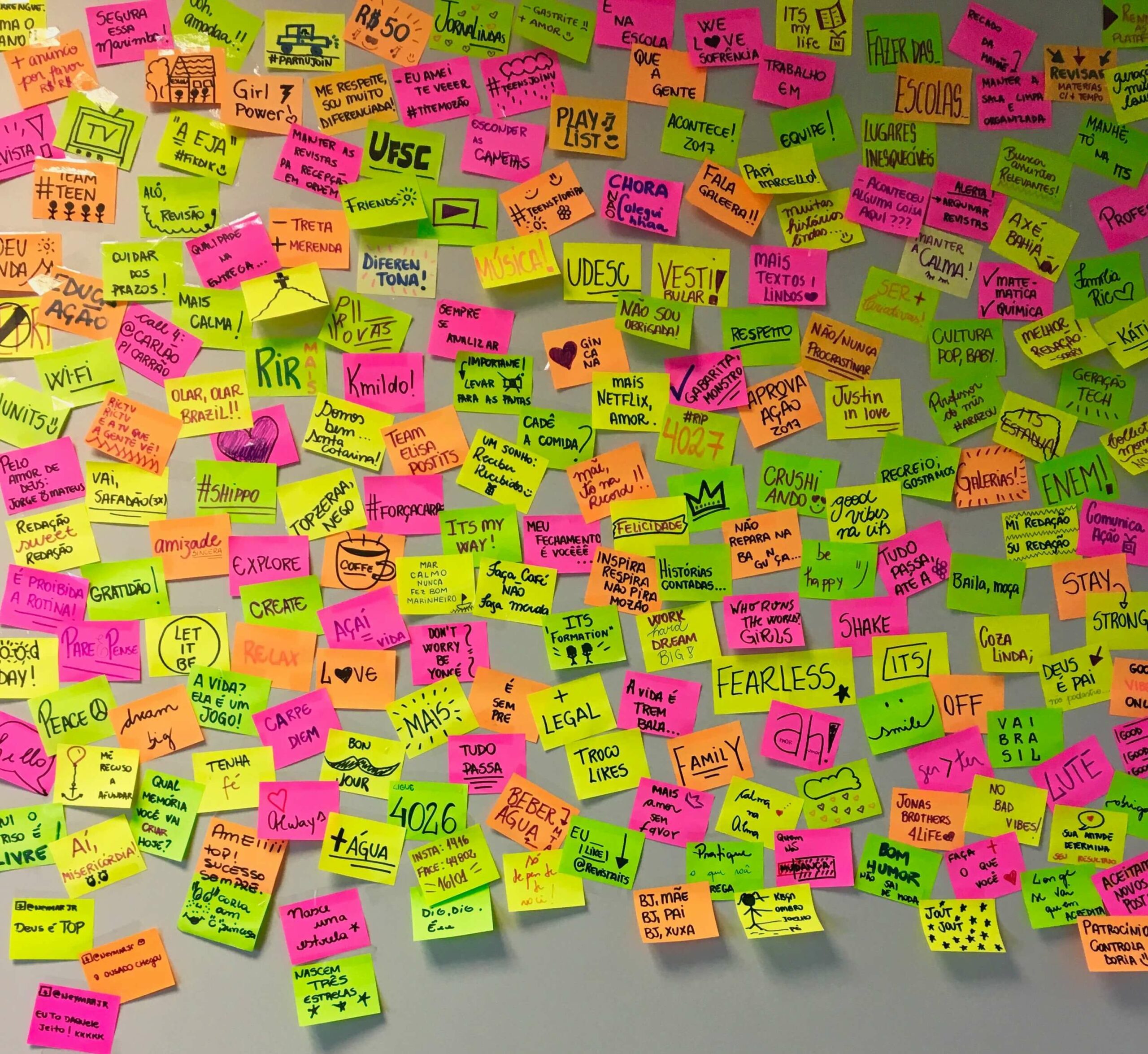 AI note-takers are replacing note set-ups like this whiteboard filled with unorganized sticky notes in bright colors.