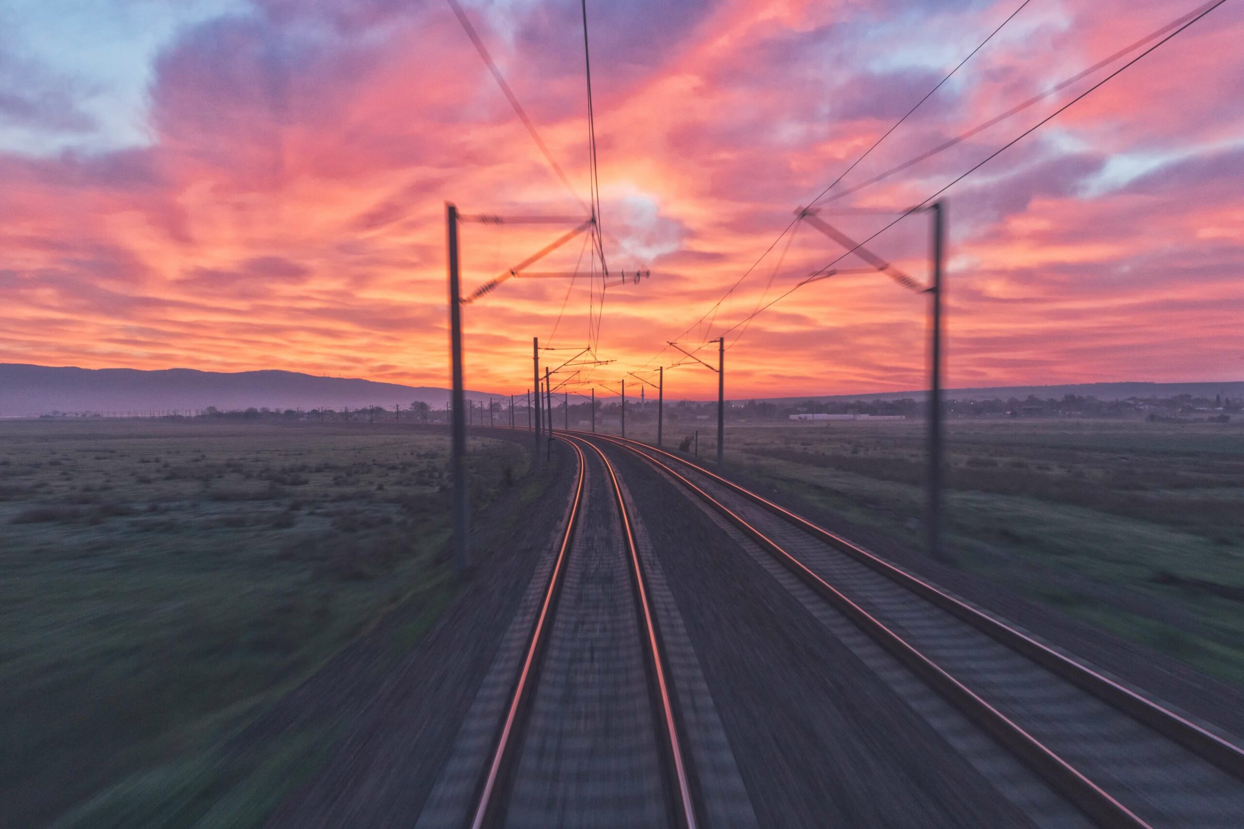 AI in Research Tips: Abstract photo of a train track at sunset