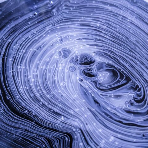 Customer Obsession Image depicts purple lights of data forming a circle to represent customer centricity